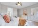 Bright and airy bedroom with modern decor and a door leading to an outdoor space at 833 Providence Glen Dr, Chapel Hill, NC 27514