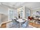 Elegant dining room featuring modern furnishings, ample natural light, and easy access to the outdoors at 833 Providence Glen Dr, Chapel Hill, NC 27514
