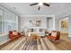 Cozy living room featuring modern furnishings, a ceiling fan, and plenty of natural light at 833 Providence Glen Dr, Chapel Hill, NC 27514