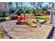 Community playground area with slides, climbing features, and ample space for outdoor fun at 833 Providence Glen Dr, Chapel Hill, NC 27514