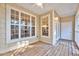Covered porch featuring wood floors and tongue and groove ceiling at 833 Providence Glen Dr, Chapel Hill, NC 27514