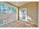 Covered porch featuring wood floors, railing, and tongue and groove ceiling at 833 Providence Glen Dr, Chapel Hill, NC 27514