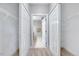 Spacious walk-in closet with built-in shelving and hanging rods, leading to bathroom at 833 Providence Glen Dr, Chapel Hill, NC 27514