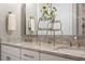 Modern bathroom with double granite vanity and decorative accents at 938 Haybeck Ln, Apex, NC 27523
