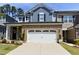 Charming two-story home featuring a brick facade, two-car garage, and well-maintained landscaping at 938 Haybeck Ln, Apex, NC 27523