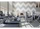 Bright fitness center featuring treadmills, ellipticals and weight machines for a complete workout experience at 938 Haybeck Ln, Apex, NC 27523