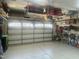Well-lit garage featuring epoxy flooring, shelving, and ample storage space at 938 Haybeck Ln, Apex, NC 27523