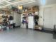 Spacious garage with epoxy flooring, shelving, and an organized storage system at 938 Haybeck Ln, Apex, NC 27523