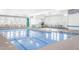 Bright indoor swimming pool with plenty of seating and natural light at 938 Haybeck Ln, Apex, NC 27523