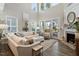 Bright and airy living room with vaulted ceilings, large windows, and comfortable seating at 938 Haybeck Ln, Apex, NC 27523