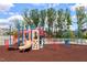 A colorful playground with slides and climbing structures for children to play and explore at 938 Haybeck Ln, Apex, NC 27523