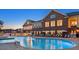 Community pool at dusk featuring lounge chairs and inviting atmosphere at 938 Haybeck Ln, Apex, NC 27523