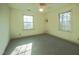 Bedroom featuring neutral walls, carpet, and two windows at 94 Cedar Hills Cir, Chapel Hill, NC 27514