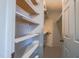 Walk-in closet with white shelving and a door at 94 Cedar Hills Cir, Chapel Hill, NC 27514