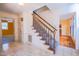 Hallway with stairs, tile floor and natural light at 94 Cedar Hills Cir, Chapel Hill, NC 27514