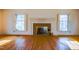 Spacious living room with beautiful hardwood floors and decorative fireplace at 94 Cedar Hills Cir, Chapel Hill, NC 27514