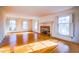 Bright living room with hardwood floors and a brick fireplace at 94 Cedar Hills Cir, Chapel Hill, NC 27514