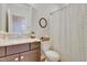 Elegant bathroom with marble countertops, modern fixtures, and a patterned shower curtain for a stylish space at 100 Highveld Ave, Chapel Hill, NC 27516