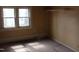 A simple room showcasing a window, closet space, and basic interior details at 1005 N Wilson Ave, Dunn, NC 28334