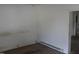 A room with minimal features, including a baseboard heater, and neutral-toned walls at 1005 N Wilson Ave, Dunn, NC 28334