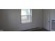 Simple room featuring a window offering natural light and plain interior at 1005 N Wilson Ave, Dunn, NC 28334