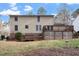 Backyard view of a two story home featuring a multi level wooden deck at 1021 Whetstone Ct, Raleigh, NC 27615