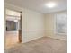 Light-filled dining area with carpet and views into other rooms at 1021 Whetstone Ct, Raleigh, NC 27615