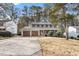Traditional two-story home with a well-manicured front yard and attached two-car garage at 1021 Whetstone Ct, Raleigh, NC 27615