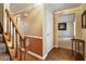 Inviting hallway with hardwood floors and staircase, creating a warm and welcoming entrance at 1021 Whetstone Ct, Raleigh, NC 27615