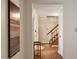 Hallway view features wooden floors and stairwell at 1021 Whetstone Ct, Raleigh, NC 27615