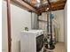 Laundry area with washer, dryer, water heater, and other utilities at 1021 Whetstone Ct, Raleigh, NC 27615
