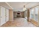 Living area with neutral paint, tile floors, and door to an outdoor patio at 1021 Whetstone Ct, Raleigh, NC 27615