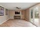View of living area with tile floors, ceiling fan, TV, and sliding glass doors at 1021 Whetstone Ct, Raleigh, NC 27615