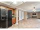 Spacious living room with tile floors, ample lighting and a mini-kitchen area at 1021 Whetstone Ct, Raleigh, NC 27615