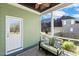 The home provides a cozy porch area to sit and relax in, offering views of the fenced in backyard at 1024 Jensen Grove Ct, Fuquay Varina, NC 27526