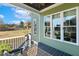 Inviting back porch with black railings features a glimpse of a large lawn and abundant sunshine at 1024 Jensen Grove Ct, Fuquay Varina, NC 27526