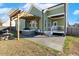 Backyard with hot tub, fountain, pergola, patio and outdoor living space with inviting style at 1024 Jensen Grove Ct, Fuquay Varina, NC 27526