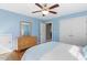 Bedroom featuring light blue walls, carpet flooring, a ceiling fan and built in closet at 1024 Jensen Grove Ct, Fuquay Varina, NC 27526