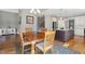 Cozy dining room next to the kitchen with hardwood floors and a view of the stairs at 1024 Jensen Grove Ct, Fuquay Varina, NC 27526