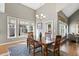 Sun-filled dining room with a high ceiling, hardwood floors and views to the backyard at 1024 Jensen Grove Ct, Fuquay Varina, NC 27526