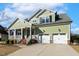 Beautiful two-story home with a spacious driveway, two-car garage, and inviting front porch at 1024 Jensen Grove Ct, Fuquay Varina, NC 27526