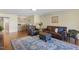 The open-concept living room features hardwood floors, light walls, and access to the kitchen at 1024 Jensen Grove Ct, Fuquay Varina, NC 27526