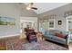 Comfortable living room featuring high ceilings, hardwood floors, and an open layout at 1024 Jensen Grove Ct, Fuquay Varina, NC 27526