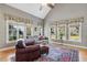 Bright and inviting living room with large windows offering views to the back yard at 1024 Jensen Grove Ct, Fuquay Varina, NC 27526