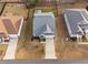 Aerial view of a well-maintained home showcasing the roof, driveway, landscaping, and surrounding neighborhood at 105 Olde Liberty Dr, Youngsville, NC 27596