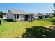 Landscaped backyard with lush lawn and iron fencing at 105 Olde Liberty Dr, Youngsville, NC 27596
