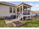 A backyard with a screened porch, patio with grill, and a small garden with room for outdoor entertaining at 105 Olde Liberty Dr, Youngsville, NC 27596