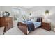 Comfortable bedroom with a wooden dresser, matching nightstands and bright natural light at 105 Olde Liberty Dr, Youngsville, NC 27596