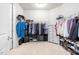 Walk-in closet with built-in shelving and ample storage space for clothes and accessories at 105 Olde Liberty Dr, Youngsville, NC 27596