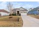 Charming single-Gathering home featuring a two-car garage and a beautifully landscaped front yard at 105 Olde Liberty Dr, Youngsville, NC 27596